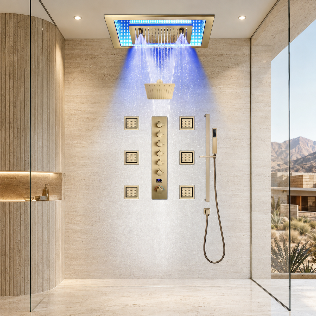 A luxury modern shower system installed in a beige stone-walled bathroom. The system features a rectangular rain shower head with blue LED lighting, a central vertical control panel with gold-toned knobs, a handheld wand with a hose, and a basket-style filter.