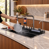 Aqua workstation sink with honeycomb basin showing water functions in a walnut kitchen