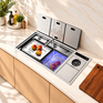 NIX38 silver workstation kitchen sink open in a bright kitchen, with hydro purification basin and cutting board
