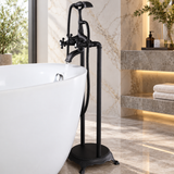 ROSA matte black freestanding tub filler beside white bathtub in marble bathroom
