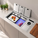 NIX38 silver workstation sink open with produce in the basin and illuminated hydro purification chamber
