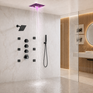 Modern wall-mounted rain shower system with a square overhead shower head emitting pink-purple water light, a handheld wand attachment, multiple black control valves, and a glass-enclosed bathroom interior.