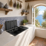 NIX38 gun grey workstation sink installed under a window with folding covers open